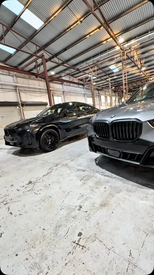Two freshly coated BMWs in the Glossworks workshop