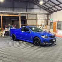 Blue Holden ute in the showroom